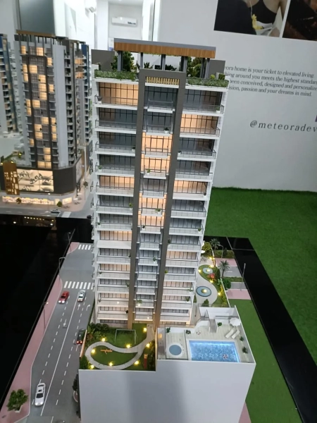 Modern 1-bedroom unit on the 13th floor in JVC, Dubai, featuring two balconies with stunning views of the community amenities.